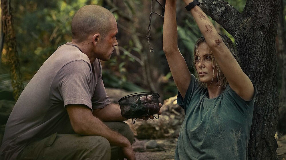 Charlize Theron e Taron Egerton em cena de O Jogo do Predador — Foto: Divulgação/Netflix